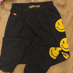 Aviator nation sweatpants.  Black with yellow smiley faces down one leg.